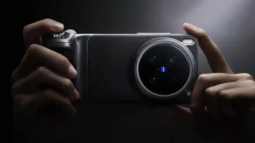 A person holding the Vivo X300 Ultra smartphone horizontally, showcasing its large circular rear camera module with a ZEISS-branded lens in a dark, dramatic lighting setup